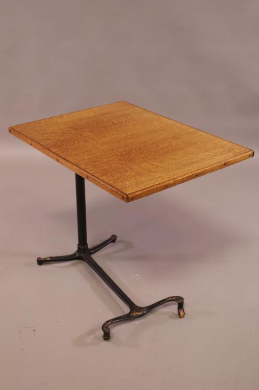 ANTIQUE OAK & METAL ADJUSTABLE BEDSIDE TABLE: ADJUSTABLE HEIGHT, IRON BASE ON CASTERS, OAK BEDSIDE TABLE. 24" W x 18" D x 32" H AS SHOWN. THIS ITEM EXCEEDS SIZE LIMITATIONS FOR IN HOUSE SHIPPING.