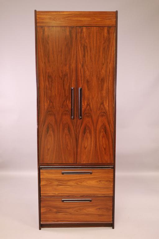 WESTNOFA MID CENTURY ROSEWOOD CHIFFOROBE: TALL ROSEWOOD CHIFFOROBE. 2 DRAWER LOWER. 2 DOOR UPPER WITH FITTED INTERIOR. MARKED ON REVERSE. 28" W x 18" D x 78" H. HAS HOLES ON THE SIDE. THIS ITEM EXCEEDS SIZE LIMITATIONS FOR IN HOUSE SHIPPING.