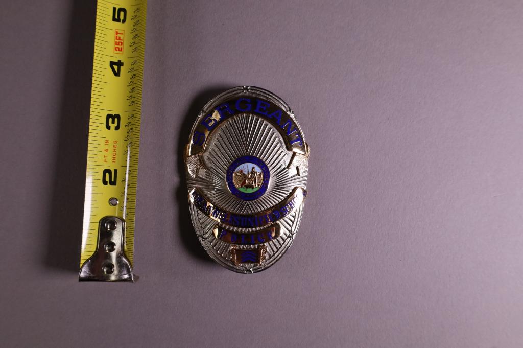 OBSOLETE LOS ANGELES SERGEANT BADGE: LA UNIFIED SCHOOL POLICE SARGEANT BADGE. MAKRED APRIL ON REVERSE.