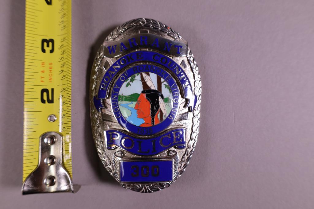 OBSOLETE ROANOKE COUNTY POLICE BADGE: ROANOKE COUNTY VIRGINIA WARRANT POLICE BADGE. BADGE #300. MARKED CUSTOM INSIGNIA ON REVERSE.