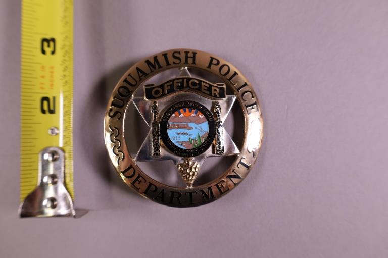 OBSOLETE SUQUAMISH POLICE BADGE: NATIVE AMERICAN SUQUAMISH TRIBE WASHINGTON POLICE BADGE. MARKED CUSTOM INSIGNIA PHOENIX ON REVERSE