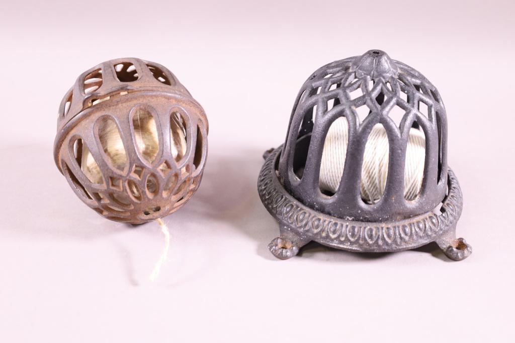 TWO CAST IRON STRING HOLDERS (1 of 4)