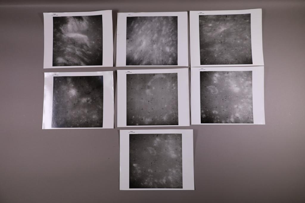 (Apollo 15) 7 Atlas photos: AS15-95- 12893 - 12899. 7 Atlas photos, Showing Manilus Crater. Vintage chromogenic print on fiber based paper 8" x 10" with NASA black mark in top margin. 12898 has damage.