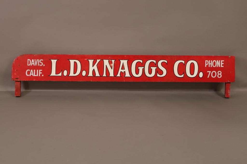 ANTIQUE CALIFORNIA TRADE SIGN: L.D. KNAGGS DAVIS CA. PAINT LOSS. PROBABLY OFF OF A TRUCK. 78" L x 16" H. THIS ITEM EXCEEDS SIZE LIMITATIONS FOR IN HOUSE SHIPPING.