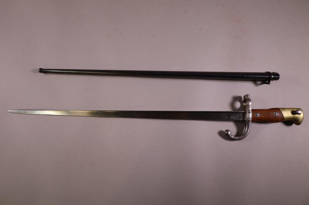 1877 FRENCH BAYONET IN SCABBARD: FRENCH MODEL 1877 BAYONET WITH SCABBARD, MATCHING SERIAL NUMBERS, 6816. GOOD CONDITION. 20 1/2" L BLADE. / 26" L.