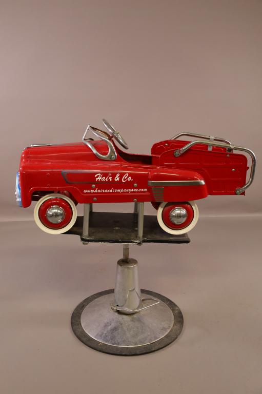 VINTAGE CHILD'S BARBER CHAIR: CONVERTED PEDAL CAR. 43" L x 43" H. THIS ITEM EXCEEDS SIZE LIMITATIONS FOR IN HOUSE SHIPPING.