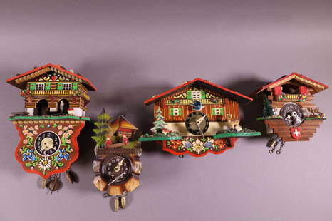 FOUR NOVELTY CUCKOO CLOCKS: FOUR GERMAN NOVELTY KEY WIND MINIATURE CUCKOO CLOCKS. JOGGILI, HECO. MISSING PENDULUMD. 5" - 7" H. ALL CLOCKS ARE SOLD AS IS WE DO NOT GUARANTEE WORKING ORDER.