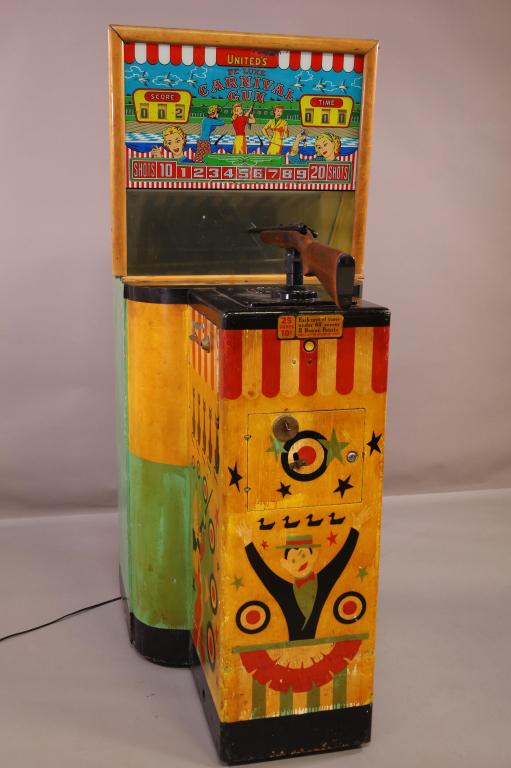 UNITED'S 10 CENT DELUXE CARNIVAL GUN: UNITED'S 10 CENT DELUXE CARNIVAL GUN GAME. PAINTED WITH CARNIVAL THEME. MINOR PAINT LOSS AND WEAR. NON WORKING, NO KEYS. THIS ITEM EXCEEDS SIZE LIMITATIONS FOR IN HOUSE SHIPPING.