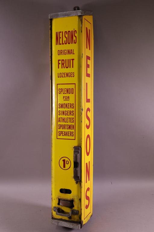 NELSON'S FRUIT LOZENGES DISPENSER: NELSON'S FRUIT LOZENGES PORCELAIN MACHINE, RUST AND CHIPS TO PORCELAIN. 31" H x 4 3/4" W.