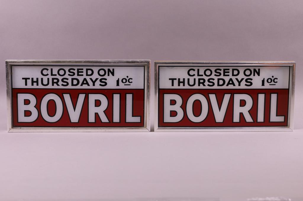 TWO BOVRIL GLASS SIGNS: REVERSE PAINTED GLASS SIGNS. PAINT LOSS AND WEAR. 12 1/2" W x 6" H.
