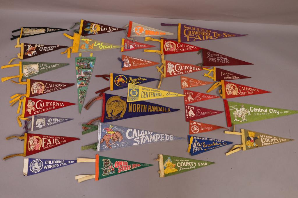 COLLECTION OF SMALL PENNANTS: COLLECTION OF 33 VARIOUS STATE FELT PENNANTS INCLUDING CALIFORNIA. FADING AND WEAR TO MOST.