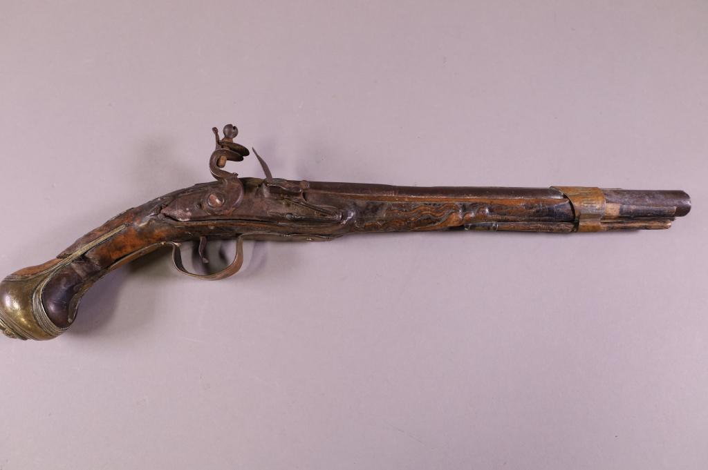 ANTIQUE FLINTLOCK PISTOL: UNMARKED ANTIQUE FLINTLOCK PISTOL WITH BRASS DECORATION. OLD REPAIR TO STOCK & BARREL. 19" L.