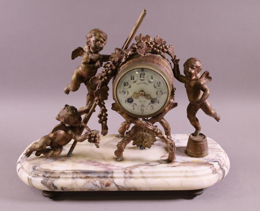 ANTIQUE CHERUB GILT METAL MANTLE CLOCK (1 of 4)