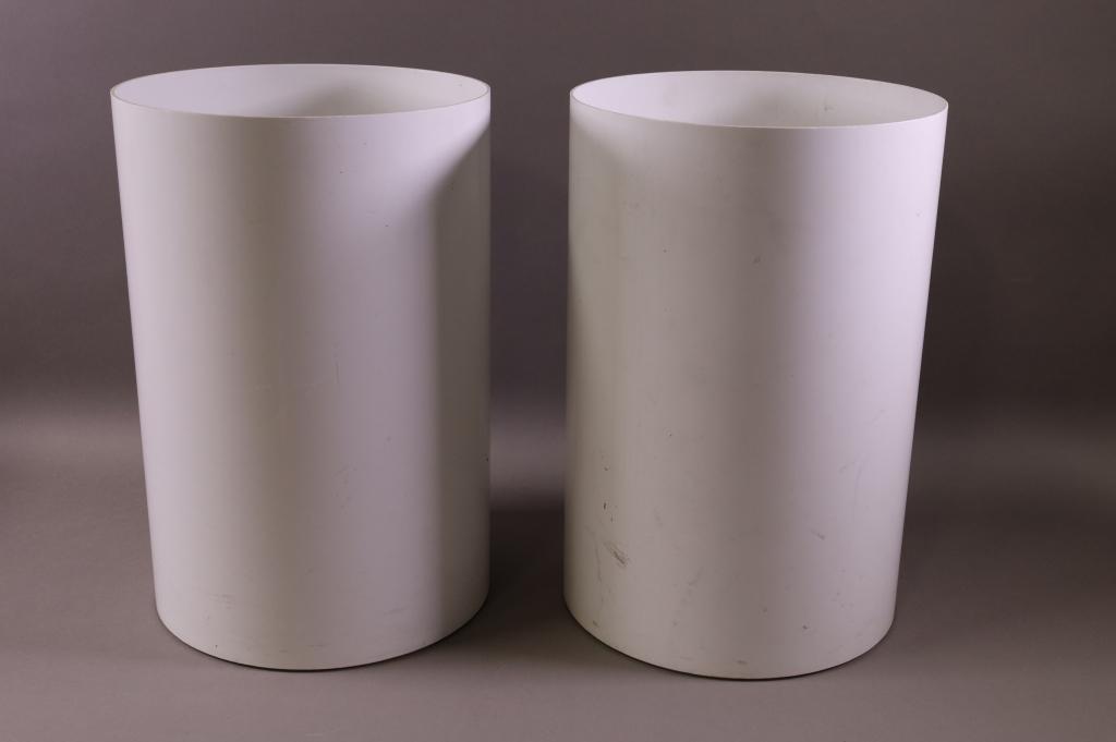 PAIR OF KARTELL WASTE BASKETS: WHITE PLASTIC WASTE BASKETS. MARKED KARTELL. SURFACE SCRATCHES AND WEAR. 14 1/2" H.