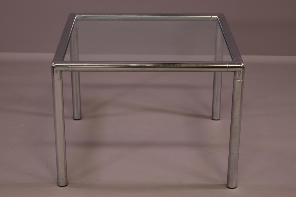 CHROME AND GLASS SIDE TABLE: SQUARE GLASS CHROME BASE. GOOD CONDITION. 27" x 27" x 20" H. THIS ITEM EXCEEDS SIZE LIMITATIONS FOR IN HOUSE SHIPPING.