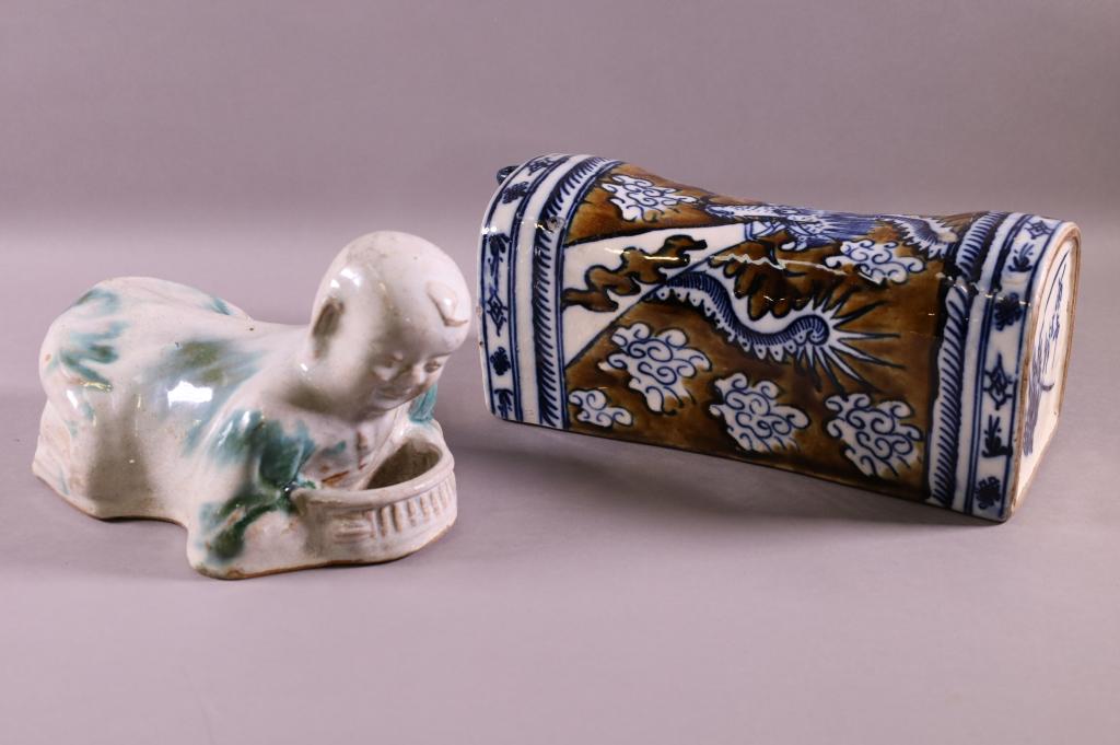 2 PORCELAIN CHINESE PILLOW VASES: ONE DRAGON DESIGN AND OTHER CHILD FORM. DRAGON IS 12" AND CHILD IS 10"