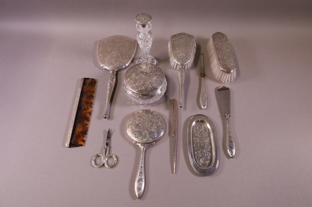 TWELVE PIECE STERLING DRESSER SET: 12 PIECE BIRKS DRESSER SET, TWO BRUSHES, HAND MIRROR, PERFUME, TRAY, SHOE HORN AND FILE AND MORE.