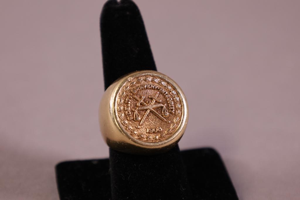 10K & 14K GOLD FBI RING: 20 YEAR SERVICE RING, MARKED 10K ON INSERT, RING TESTED AT 14K. APPROX 25 GRAMS.