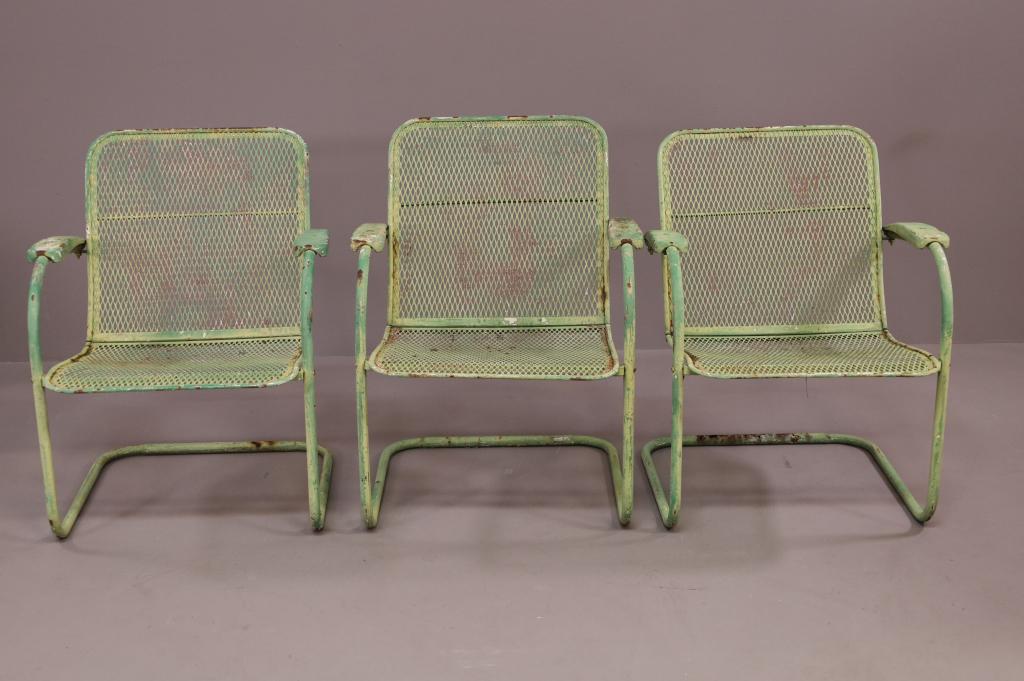 3 MID CENTURY METAL PATIO CHAIRS: PAINTED FINIISH, RUST. PAINT LOSS. 25" W x 27" D x 32" H. THIS ITEM EXCEEDS SIZE LIMITATIONS FOR IN HOUSE SHIPPING.