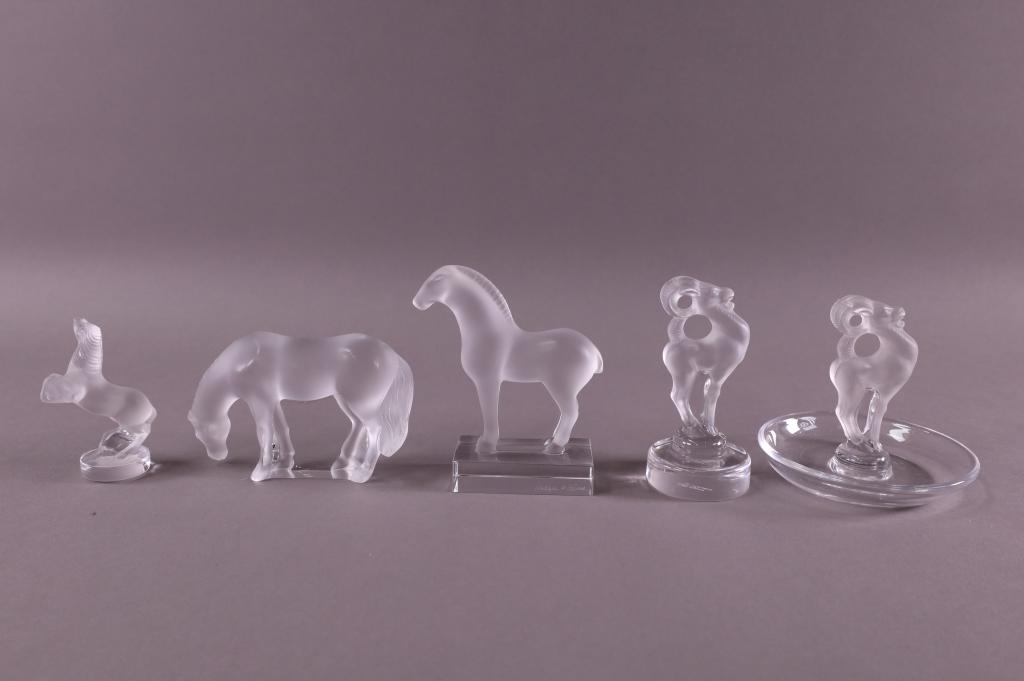 FIVE PIECES OF LALIQUE (1 HAS BOX): FIVE LALIQUE ANIMALS, TWO HORSES, TWO RAMS. RING HOLDERS, & SEALS. SIGNED. ONE OF HORSES HAVE ORIGINAL BOX. 3" - 3 3/4" H. GOOD CONDITION, NO CHIPS CRACKS OR BREAKS.