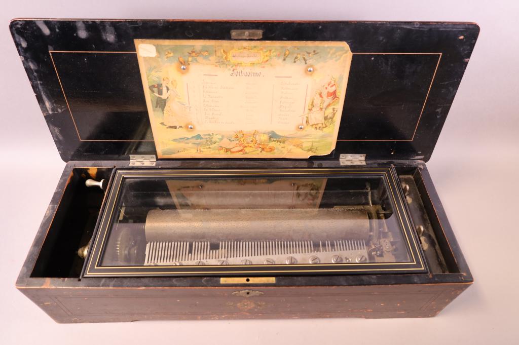 ANTIQUE INLAID SWISS MUSIC BOX: SINGLE COMB MUSIC BOX. BROKEN TEETH. DOES NOT WORK. FINISH WEAR. 23" L x 9" D x 5 1/2" H.
