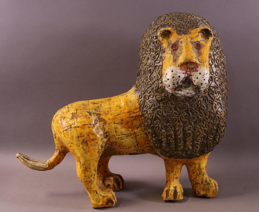 PAPIER MACHE LION SCULPTURE: SIGNED JEANNE VALENTINE. MADE IN MEXICO. 18" L x 15 1/2" H.