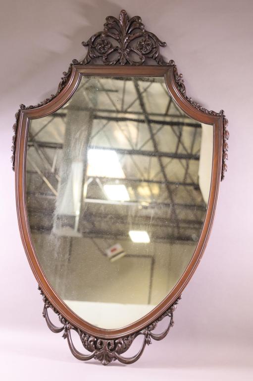 CARVED WALL MIRROR: CARVED MAHOGANY WALL MIRROR, GOOD CONDITION. 27" W x 44" H. THIS ITEM EXCEEDS SIZE LIMITATIONS FOR IN HOUSE SHIPPING.