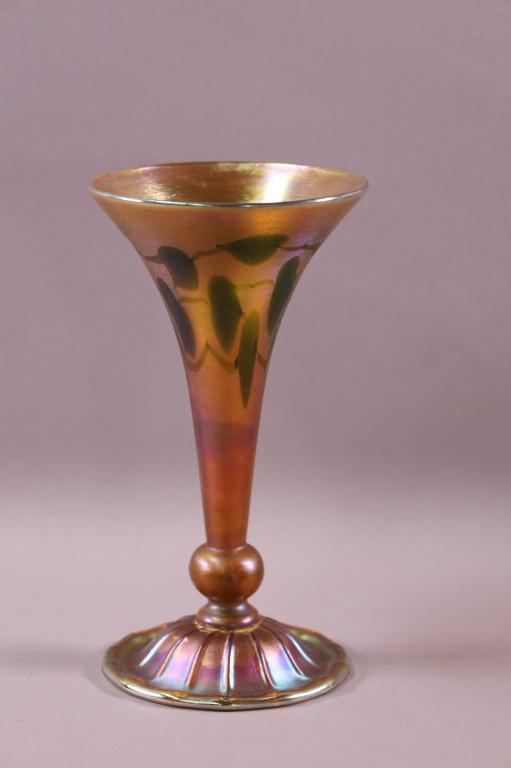 L.C.T. TIFFANY FAVRILE VASE: MARKED L.C.T TIFFANY FAVRILE 80952. LEAF AND VINE FOOTED VASE. GOOD CONDITION. 10" H
