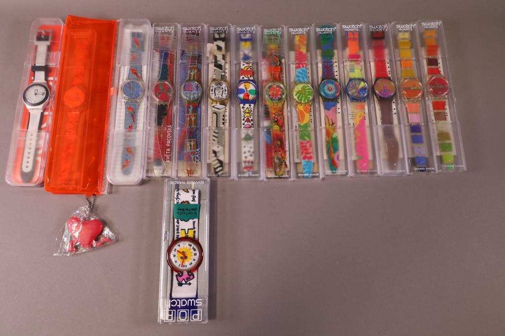 COLLECTION OF SWATCHES: 15 SWATCHES. IN CASE. ALL WATCHES ARE SOLD AS IS WE DO NOT GUARANTEE WORKING ORDER.