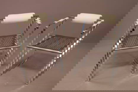 PAIR OF MARIO BOTTA ARM CHAIRS: PAIR OF MARIO BOTTA SECONDA FOR ALIAS ITALY. CHROME AND WHITE LEATHERETTE. MISSING SEAT. UPHOLSTERY NEEDS CLEANED. 20 1/2" W x 20" D x 30" H. THIS ITEM EXCEEDS SIZE LIMITATIONS FOR IN HOUSE SHIPPING.