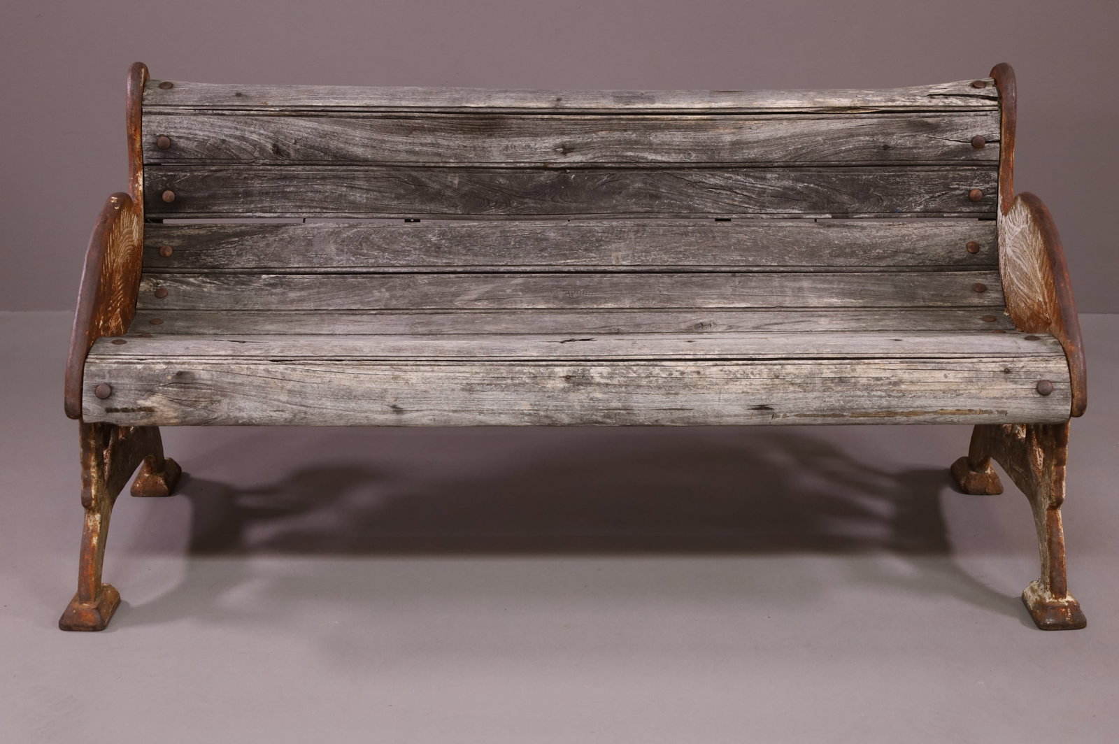 VICTORIAN CAST IRON & WOOD CRANE BENCH: VICTORIAN CRANE BENCH FROM COLCHESTER ENGLAND. CRANE FORM IRON SIDES. WOOD SLATS. DAMAGE TO SLATS, RUST TO IRON. 55" W x 24" D x 28" H. THIS ITEM EXCEEDS SIZE LIMITATIONS FOR IN HOUSE SHIPPING.