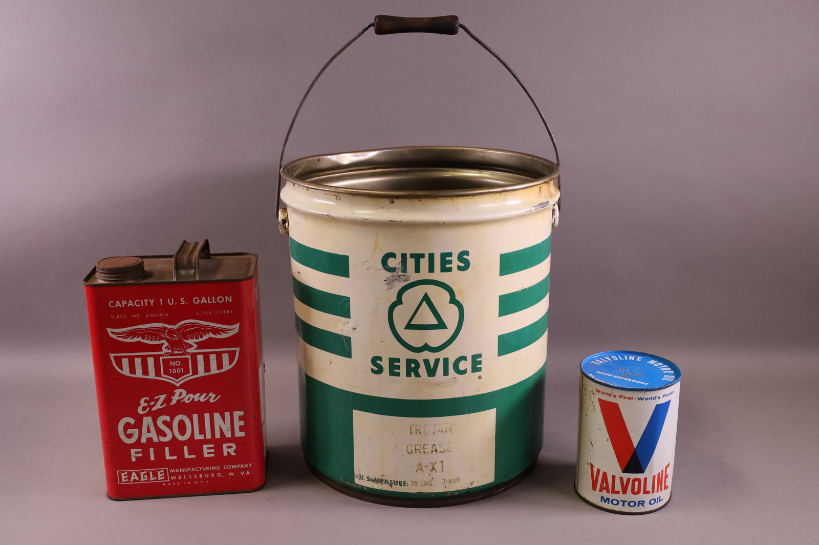 THREE OIL CANS (1 of 4)