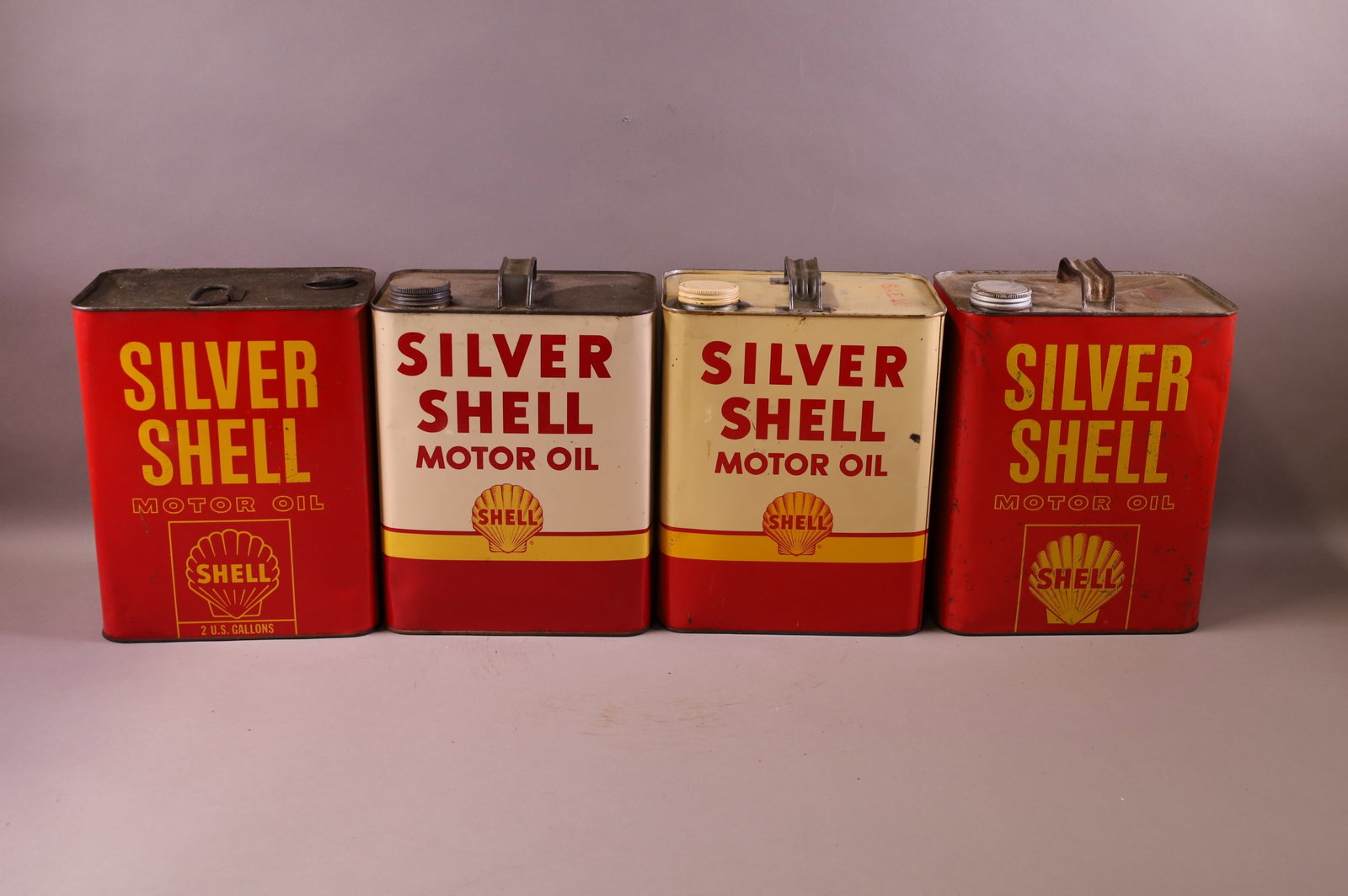 FOUR SHELL OIL CANS (1 of 2)