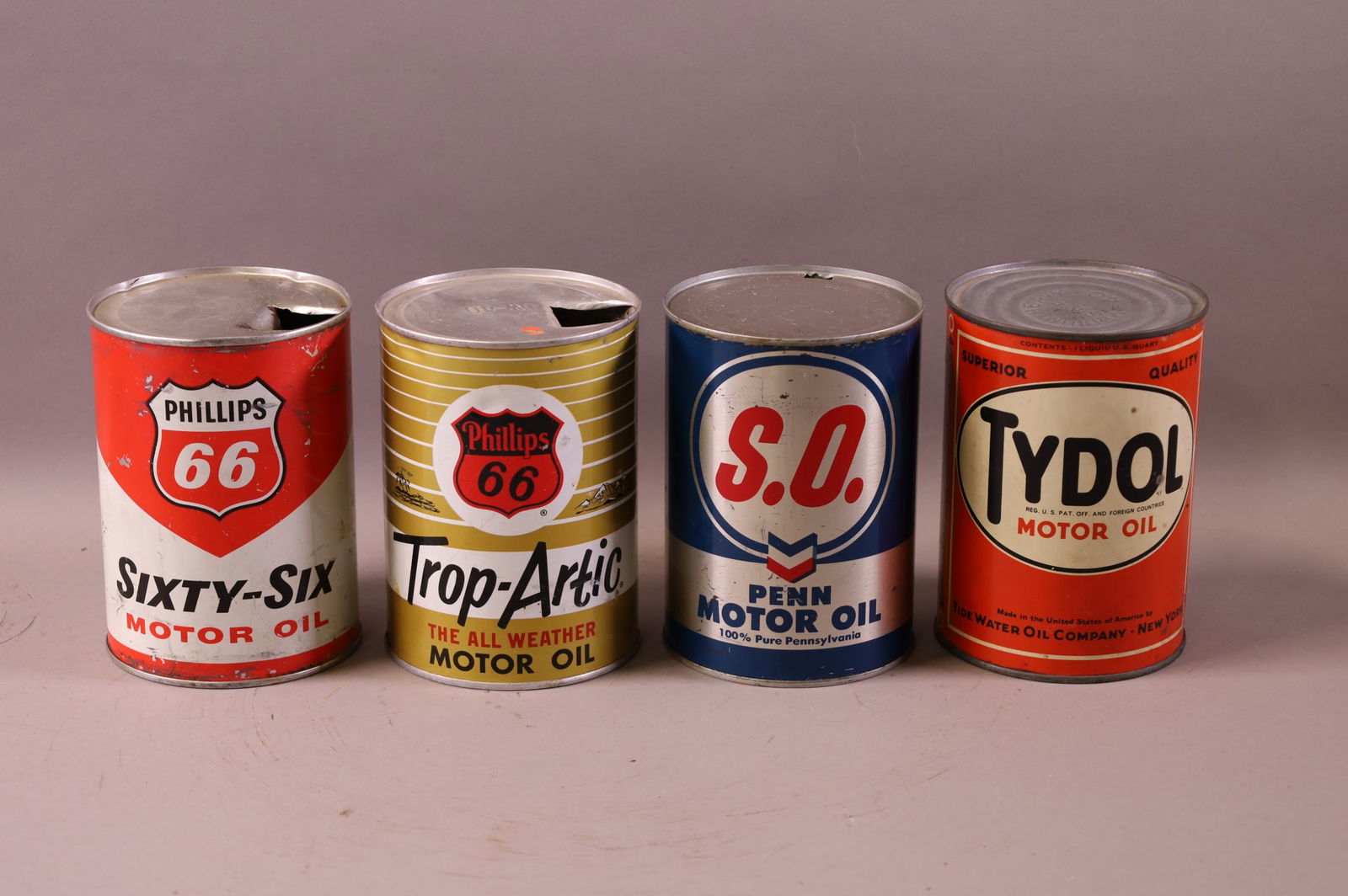 FOUR OIL CANS (1 of 2)