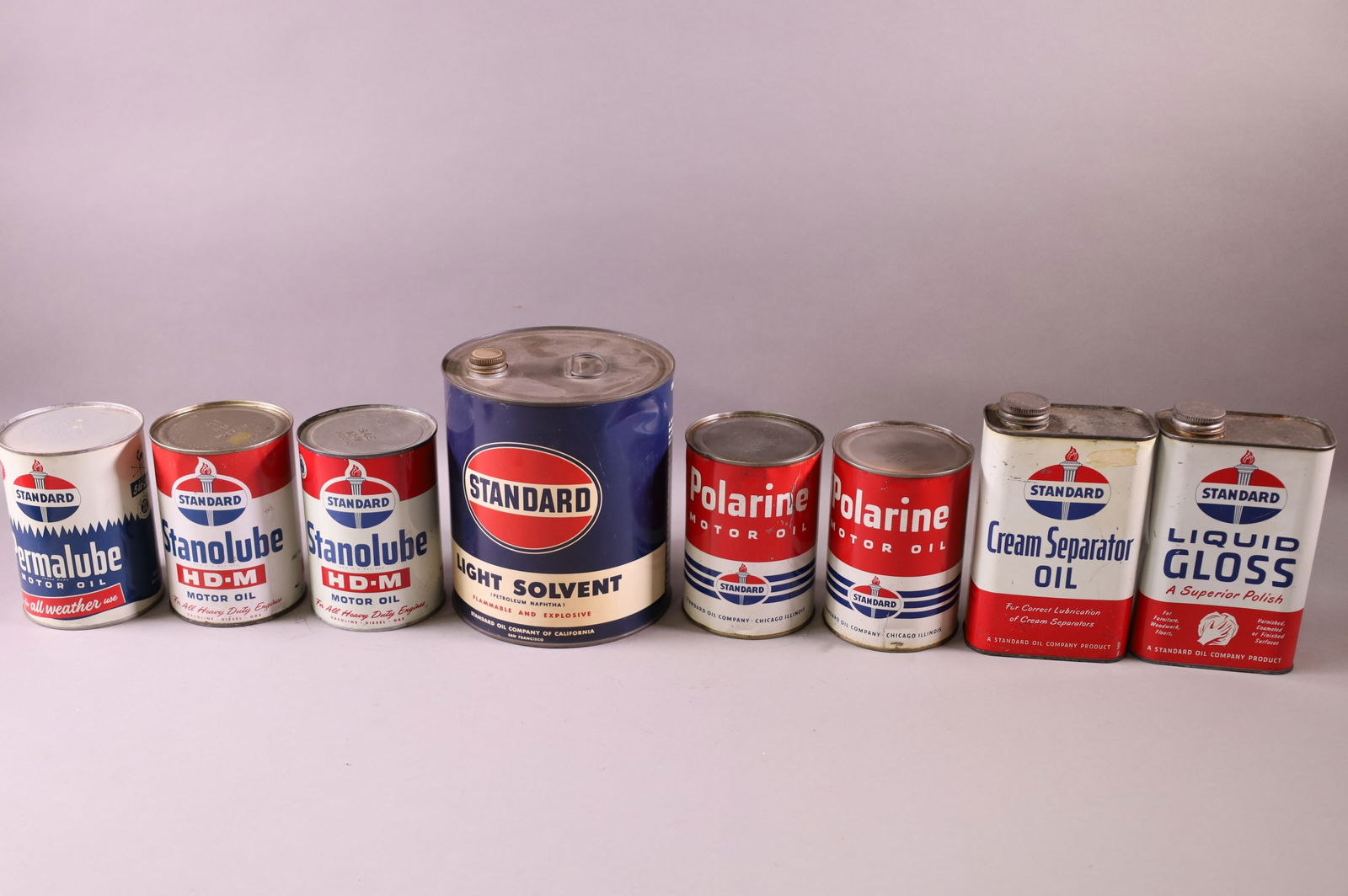 EIGHT STANDARD OIL CANS (1 of 3)
