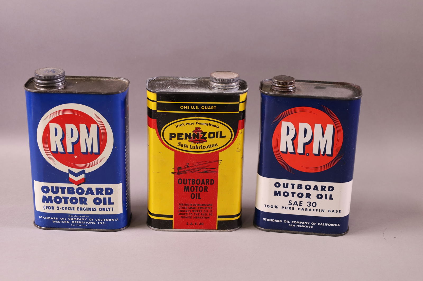 THREE OUTBOARD OIL CANS (1 of 1)
