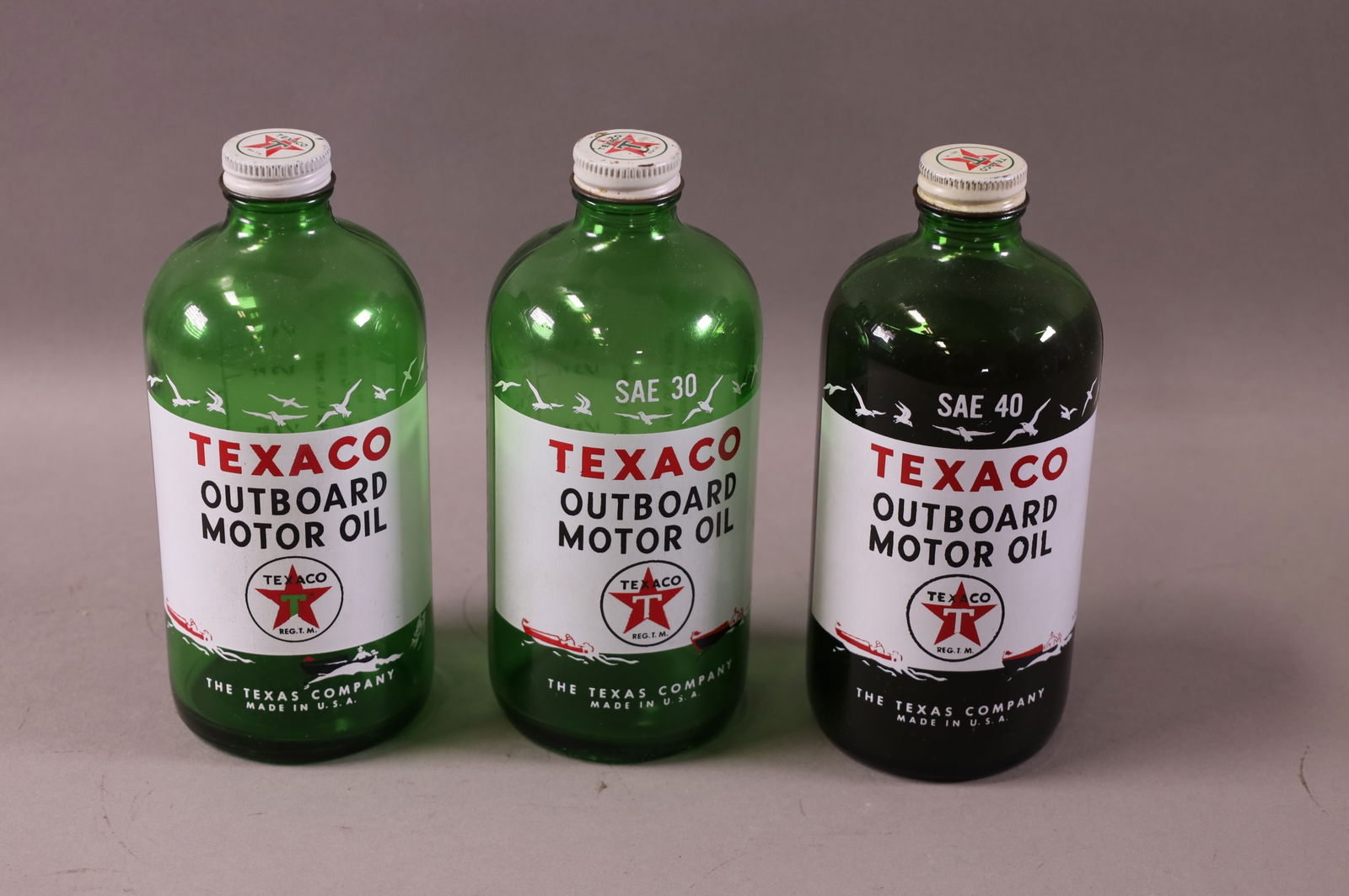 THREE TEXACO OUTBOARD OIL JARS (1 of 2)