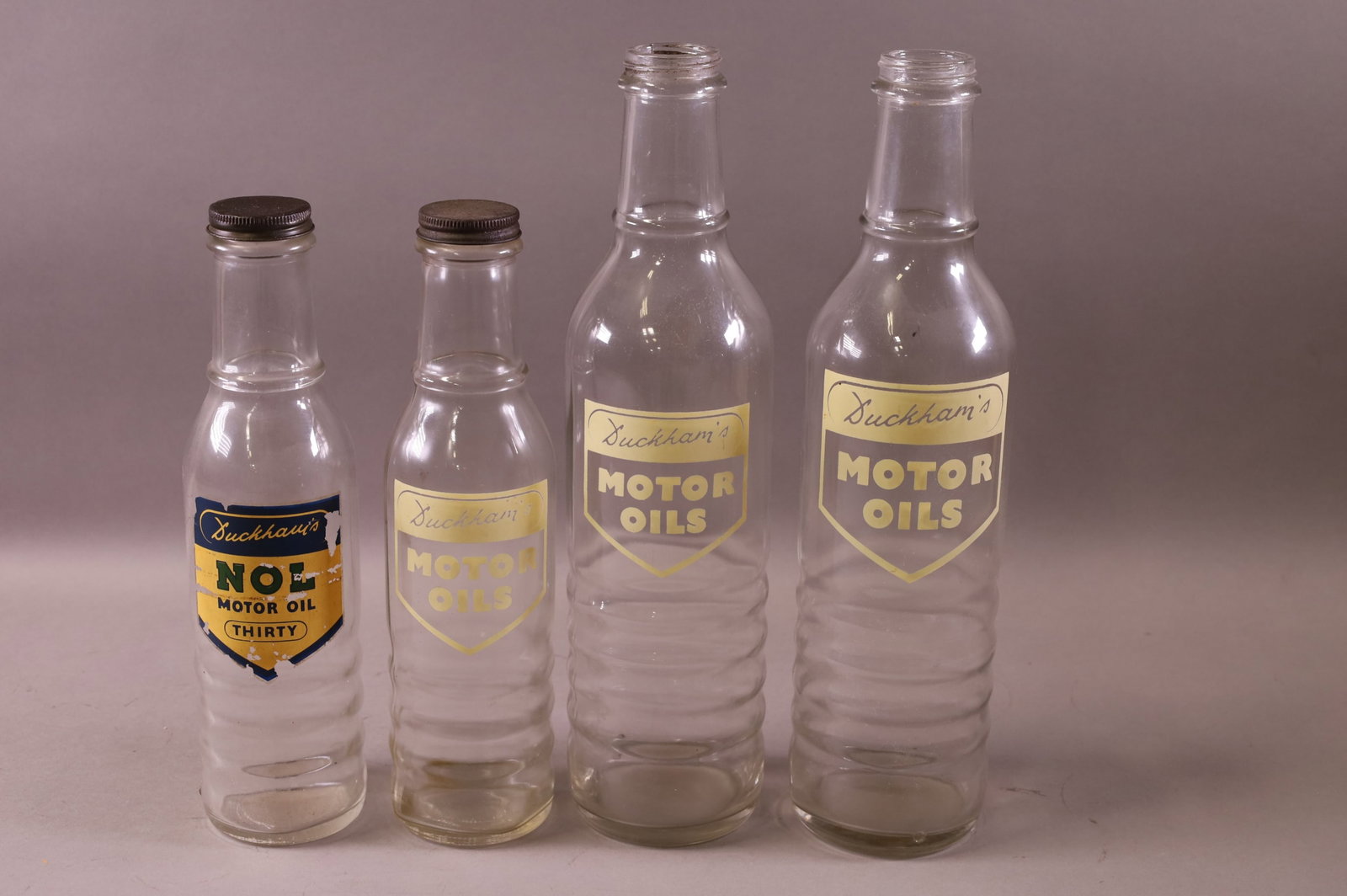FOUR DUCKHAM'S OIL BOTTLES (1 of 3)