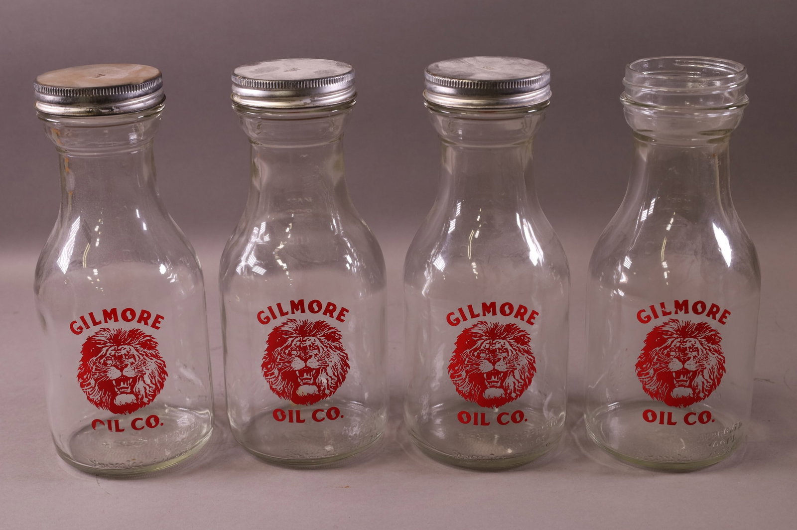FOUR REPRODUCTION GILMORE OIL BOTTLES (1 of 3)