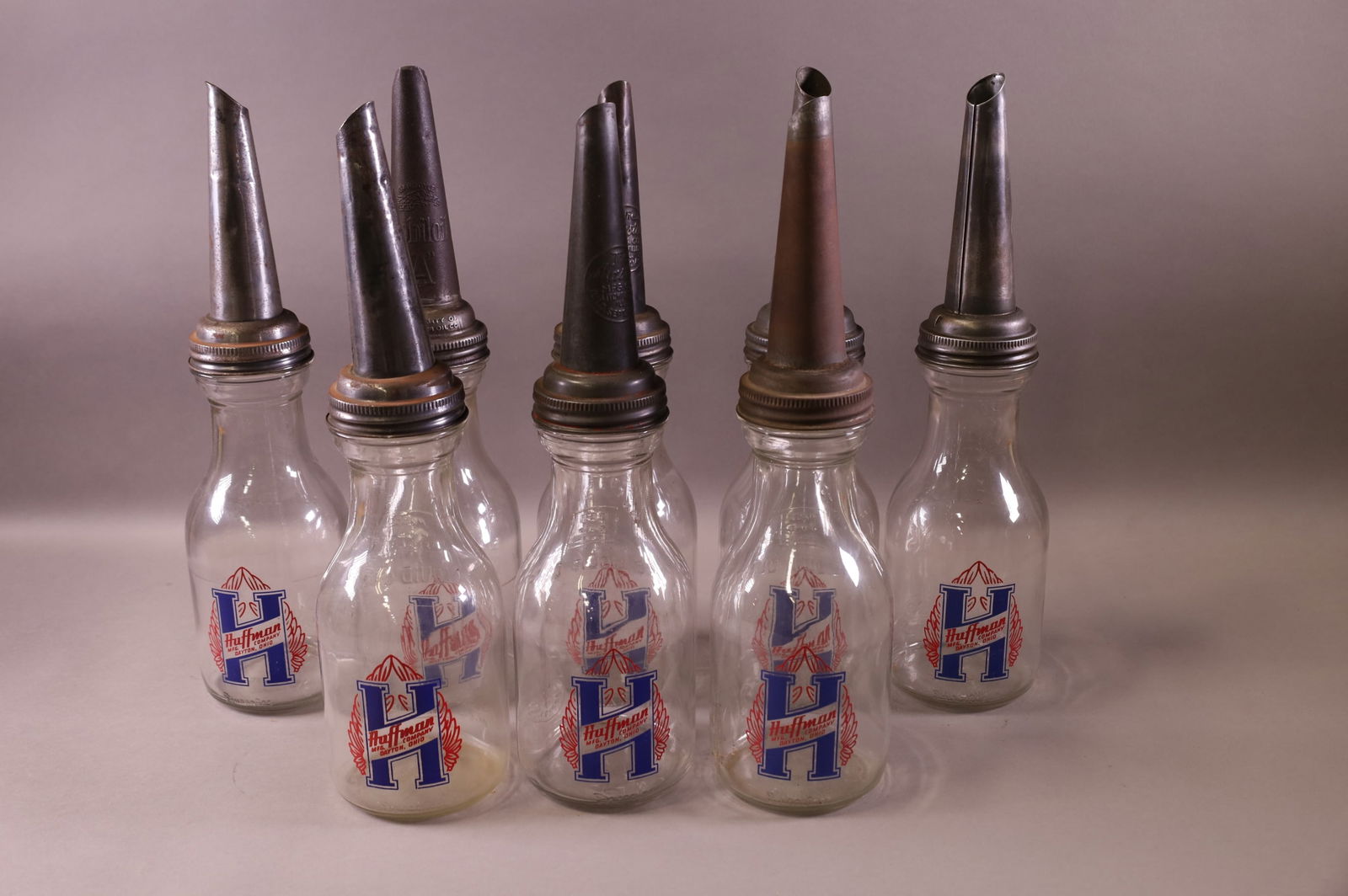 EIGHT HUFFMAN OIL BOTTLES (1 of 3)