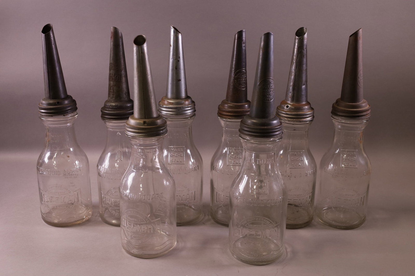 EIGHT HUFFMAN OIL BOTTLES (1 of 3)