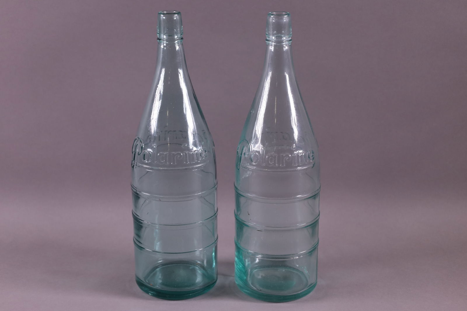 TWO POLARINE OIL BOTTLES (1 of 3)