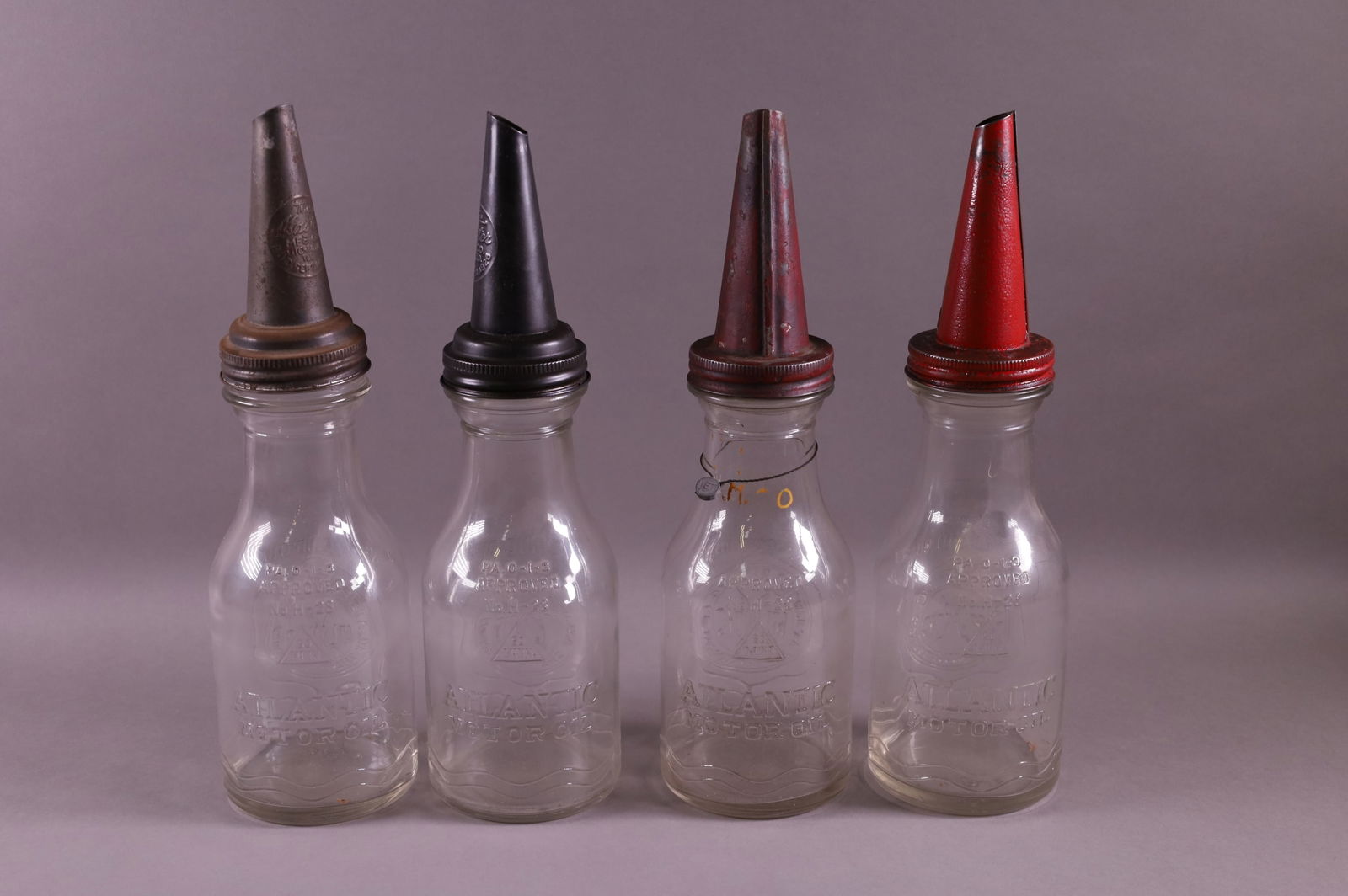 FOUR ATLANTIC OIL BOTTLES (1 of 2)