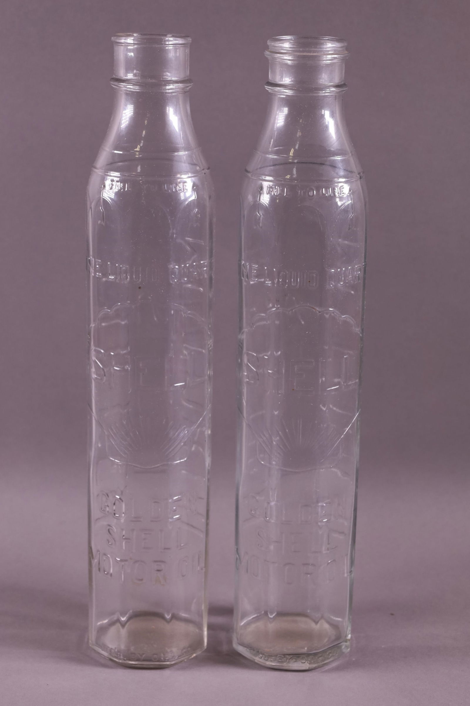 TWO GOLDEN SHELL OIL BOTTLES (1 of 2)