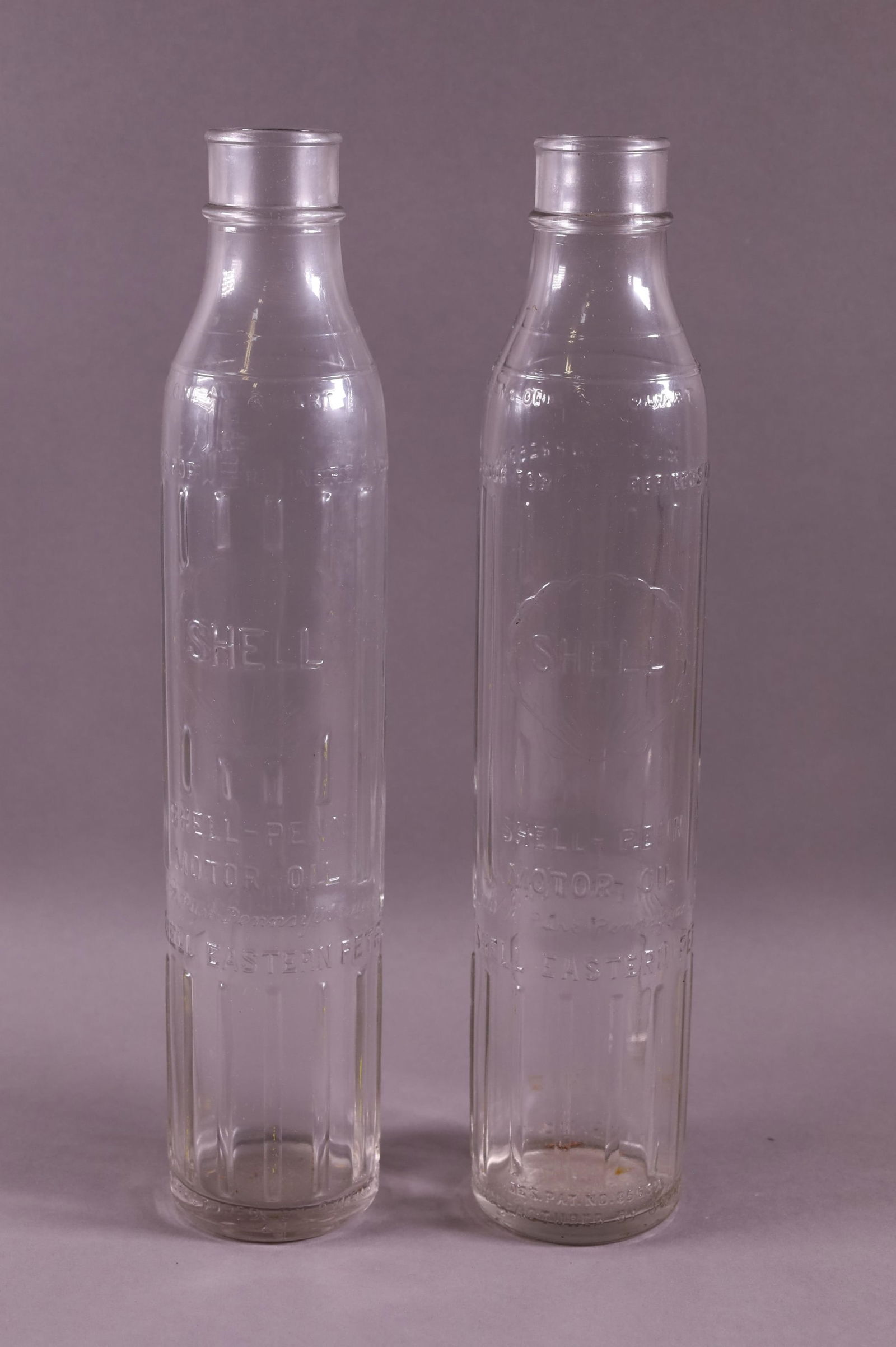 TWO SHELL OIL BOTTLES (1 of 2)