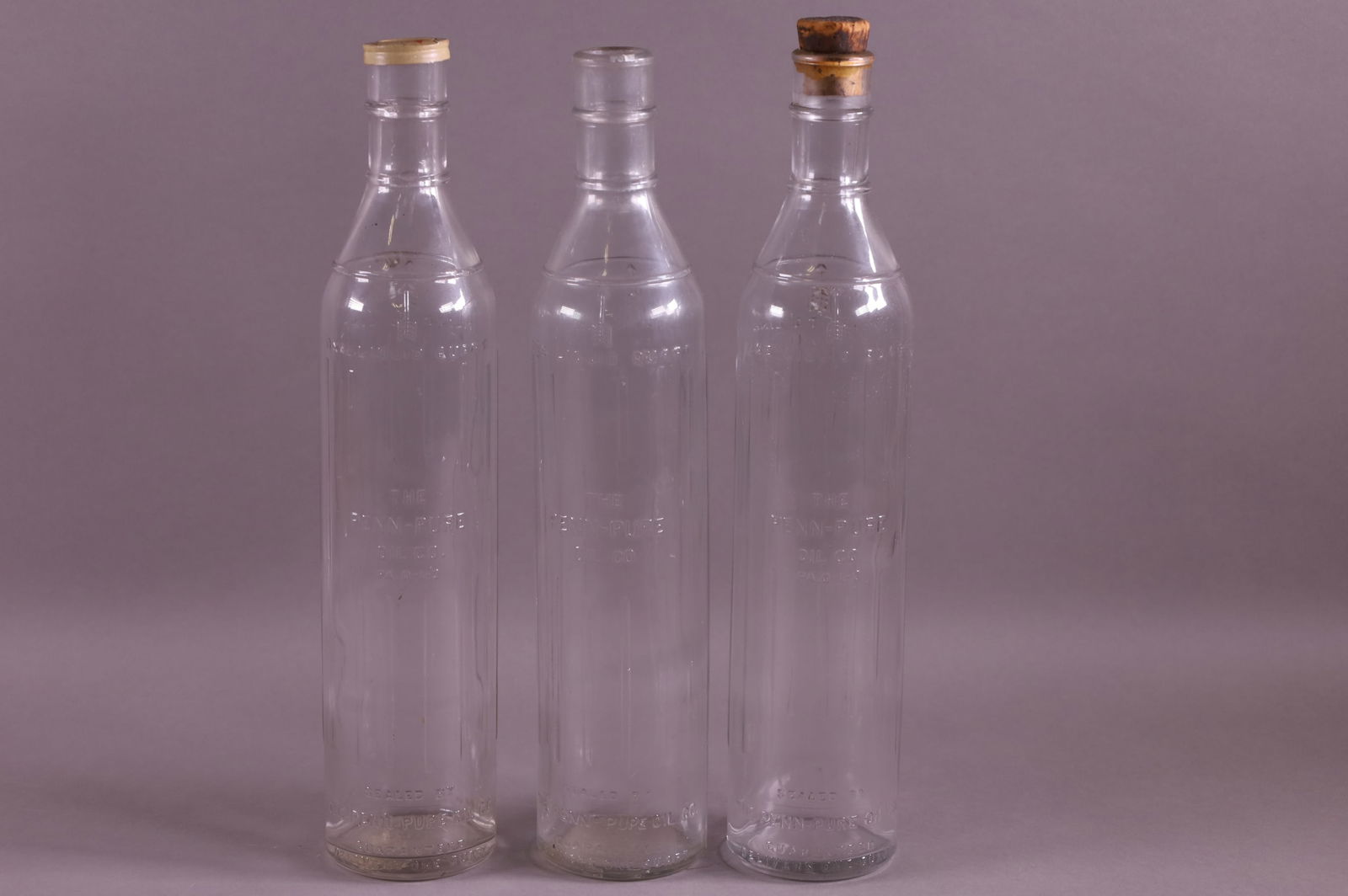 THREE PENN PURE OIL BOTTLES (1 of 2)
