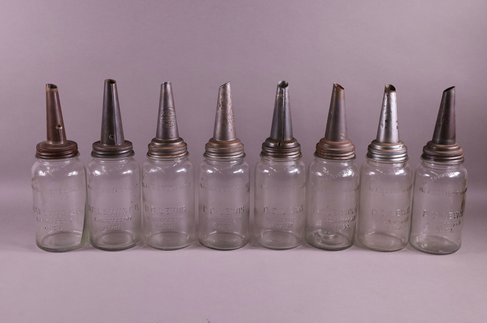 EIGHT D.D. LOUIS OIL BOTTLES (1 of 2)