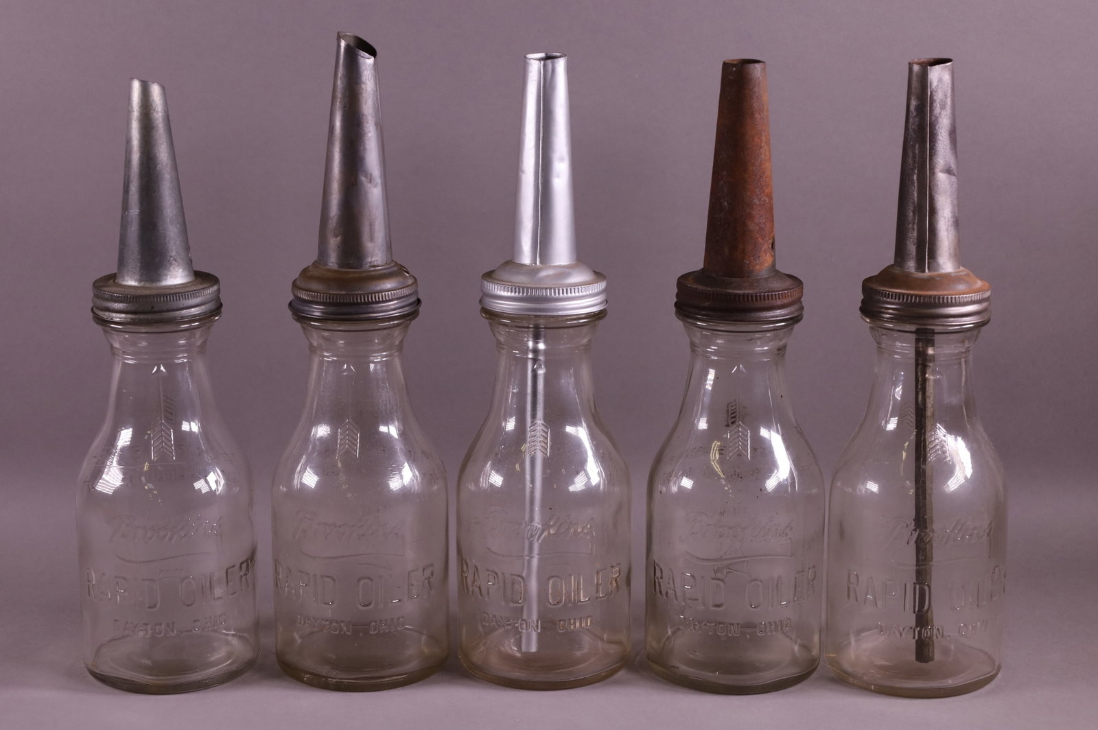 FIVE BROOKINS OIL BOTTLES (1 of 2)