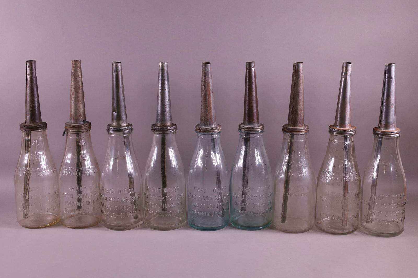 NINE OIL BOTTLES (1 of 3)