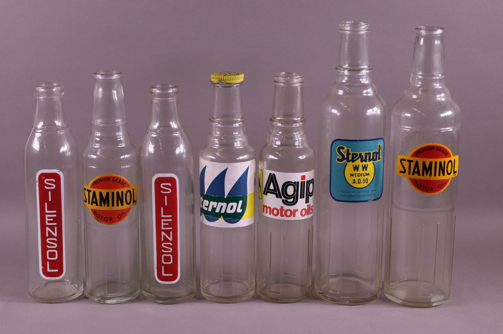 SEVEN OIL BOTTLES (1 of 3)
